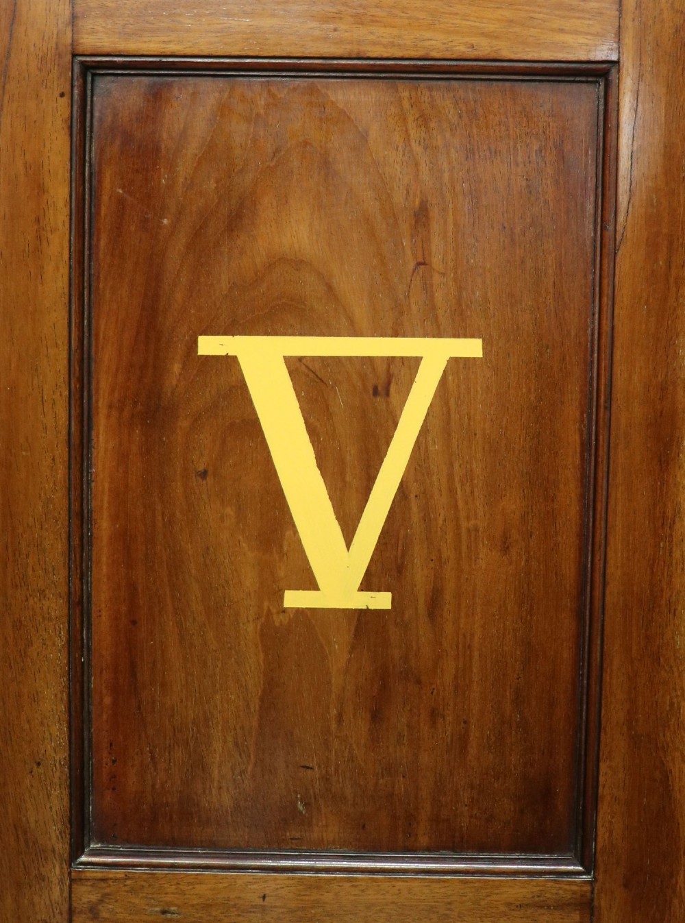 A George III mahogany wall-mounted corner cabinet with double panelled doors featuring painted yellow Roman numerals and a top frieze reading WHITEHALL 1212. View VIII