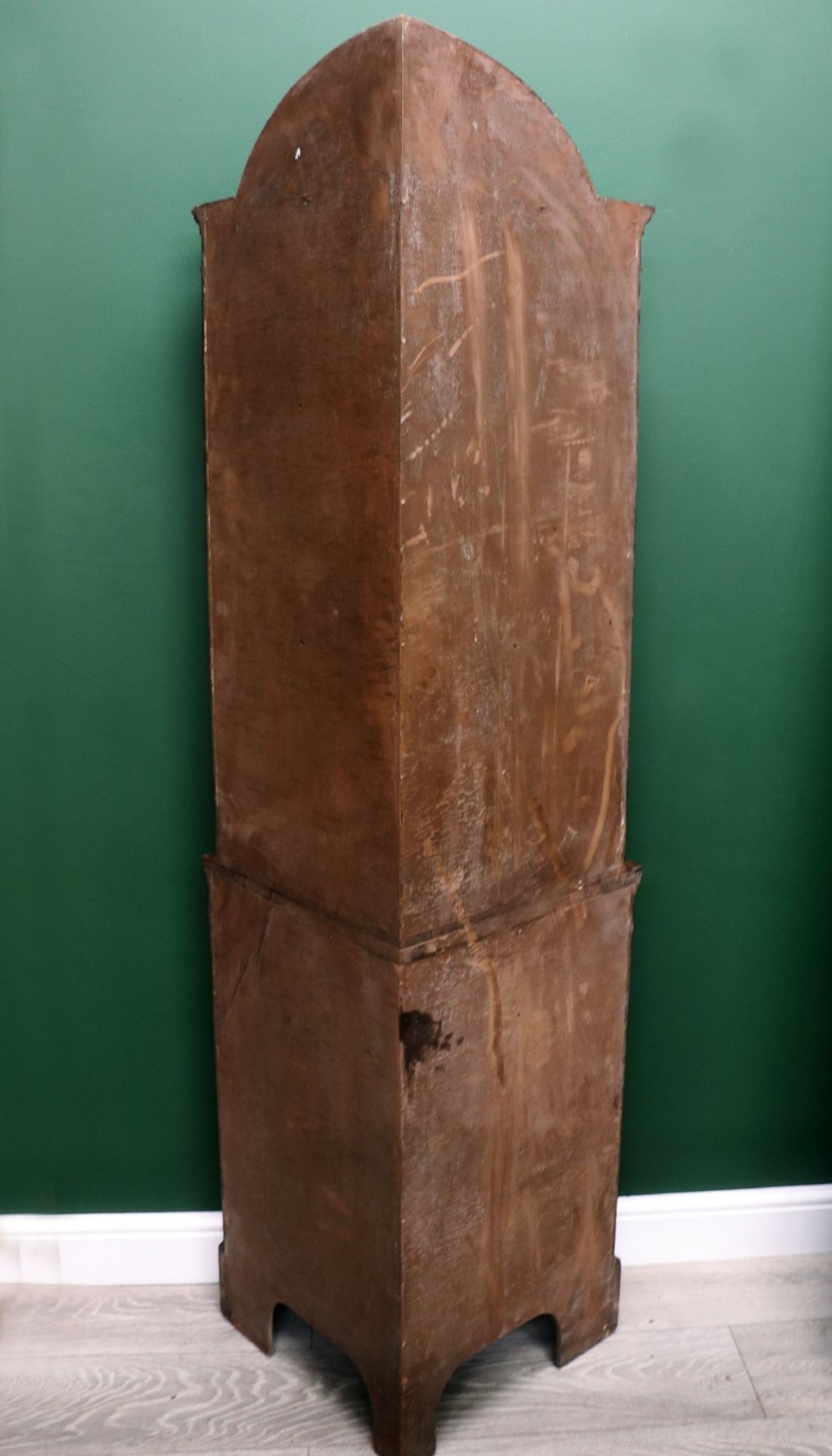 An early 20th-century floor-standing oak corner cabinet featuring an arched glazed upper door and a solid wood lower cupboard door. View XV