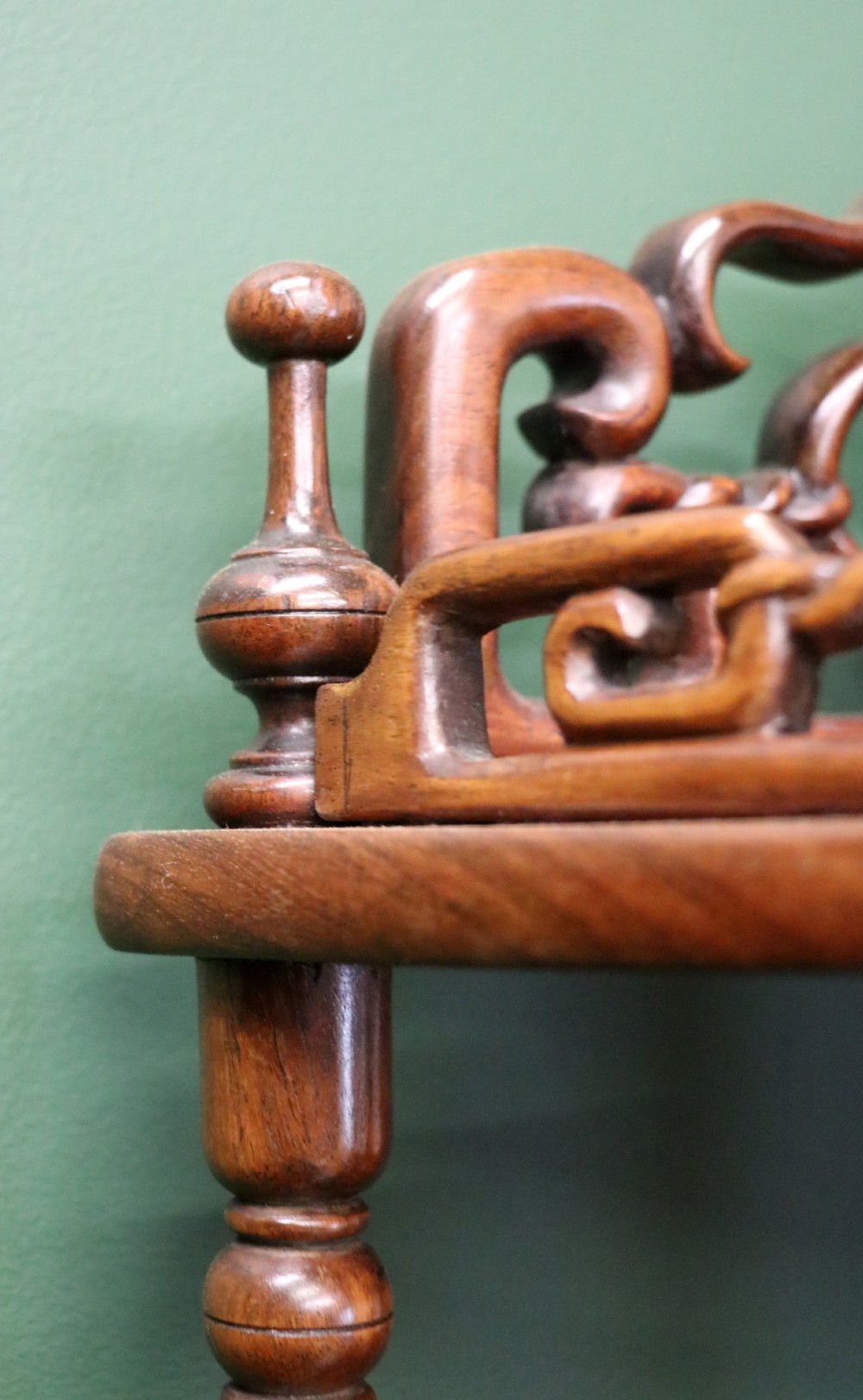 A matching pair of Victorian dark wood five-tier corner whatnots featuring turned spindle supports, carved pierced galleries, and decorative finials. View VIII