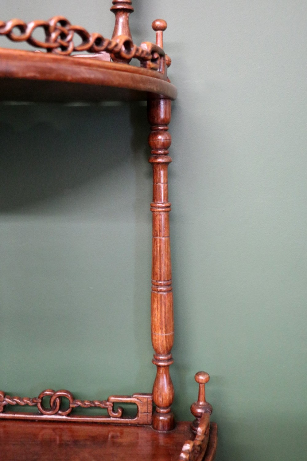 A matching pair of Victorian dark wood five-tier corner whatnots featuring turned spindle supports, carved pierced galleries, and decorative finials. View IX