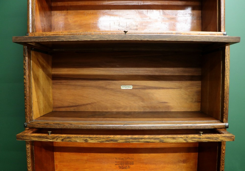 A five-tier Edwardian oak Globe Wernicke stacking bookcase with glass lift-up cabinet doors. View VII