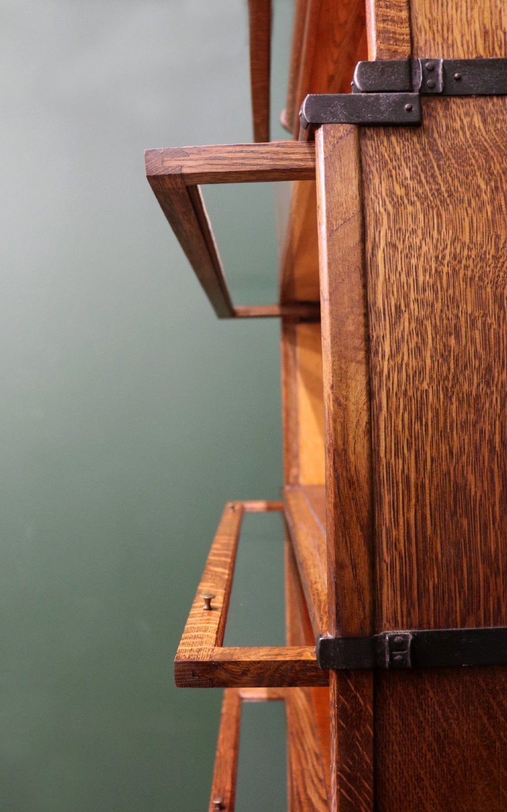 A five-tier Edwardian oak Globe Wernicke stacking bookcase with glass lift-up cabinet doors. View IX