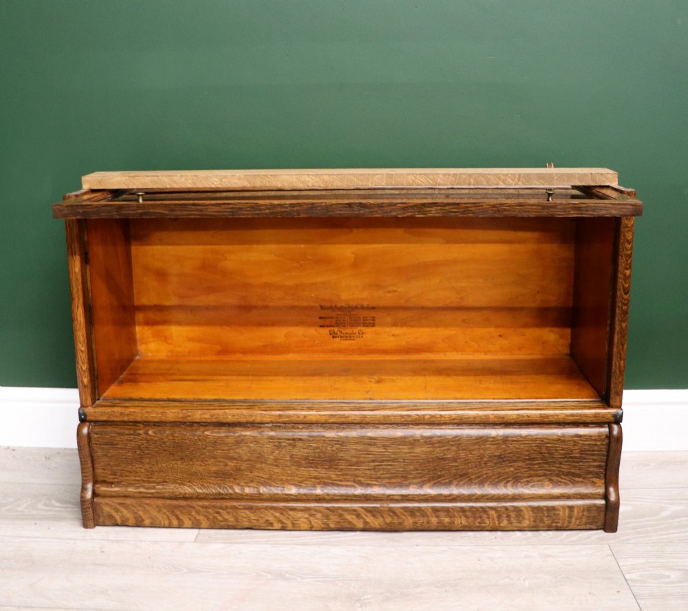 A five-tier Edwardian oak Globe Wernicke stacking bookcase with glass lift-up cabinet doors. View XI