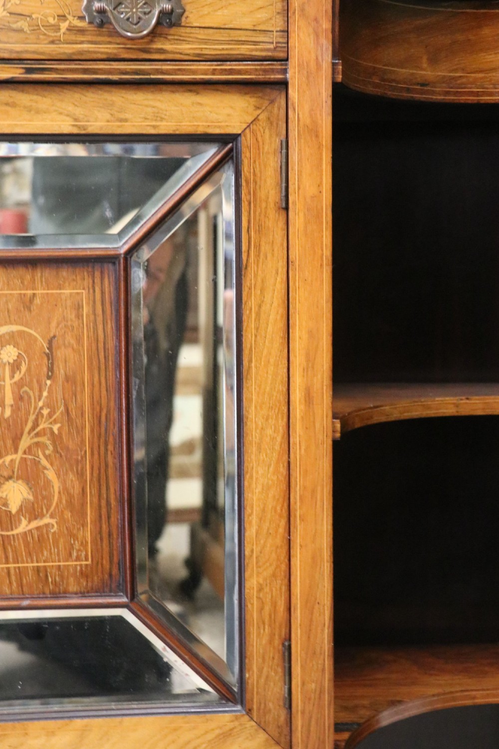 A late Victorian wooden credenza featuring a central inlaid cupboard door, open side shelves, turned spindle pillars, and a multi-pane mirrored back with a fretwork gallery top. View XIII