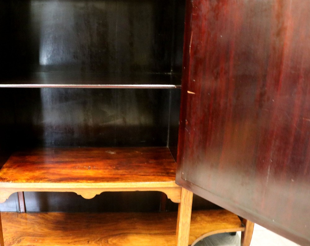 A late Victorian wooden credenza featuring a central inlaid cupboard door, open side shelves, turned spindle pillars, and a multi-pane mirrored back with a fretwork gallery top. View XV
