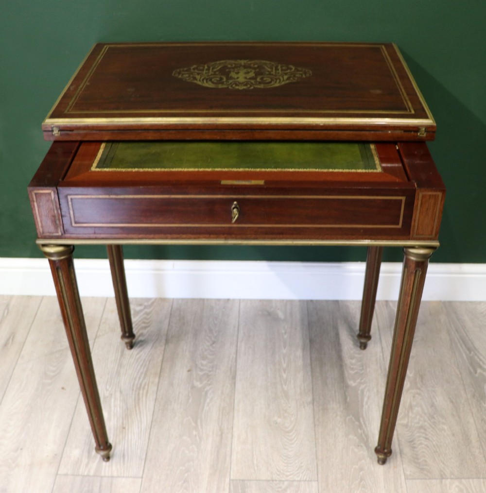 A late nineteenth-century French wooden vanity table featuring an open hinged lid with a mirror, interior satinwood compartments, and slender fluted legs. View III