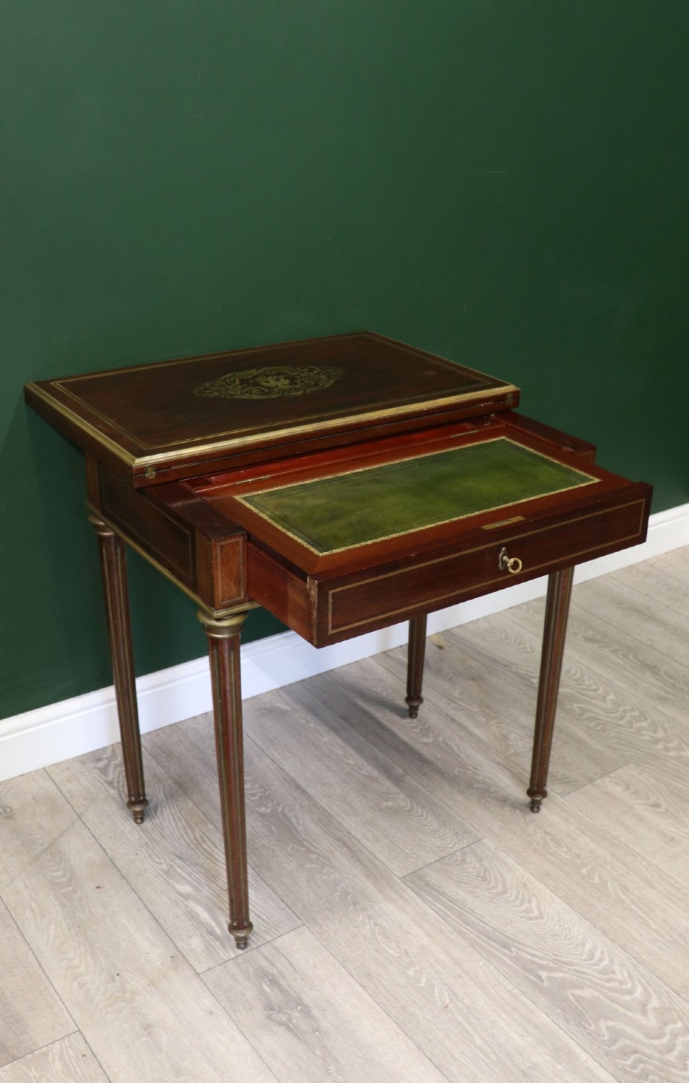 A late nineteenth-century French wooden vanity table featuring an open hinged lid with a mirror, interior satinwood compartments, and slender fluted legs. View VII