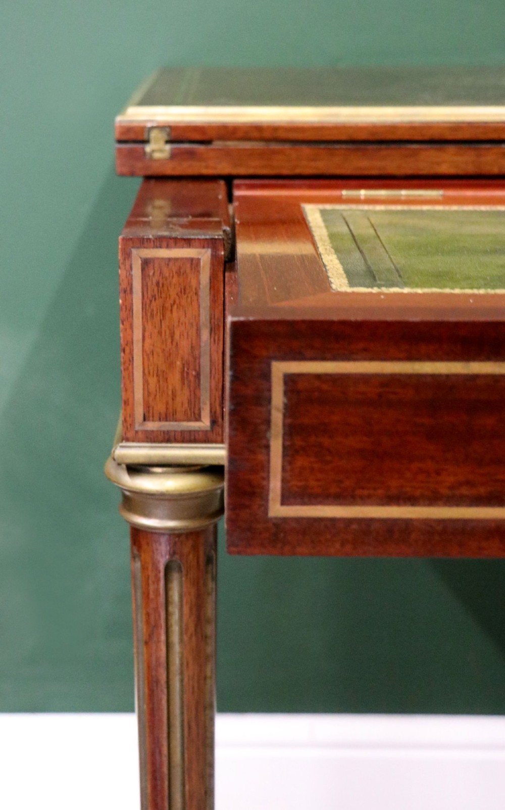 A late nineteenth-century French wooden vanity table featuring an open hinged lid with a mirror, interior satinwood compartments, and slender fluted legs. View IX