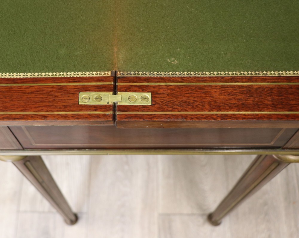 A late nineteenth-century French wooden vanity table featuring an open hinged lid with a mirror, interior satinwood compartments, and slender fluted legs. View XIII