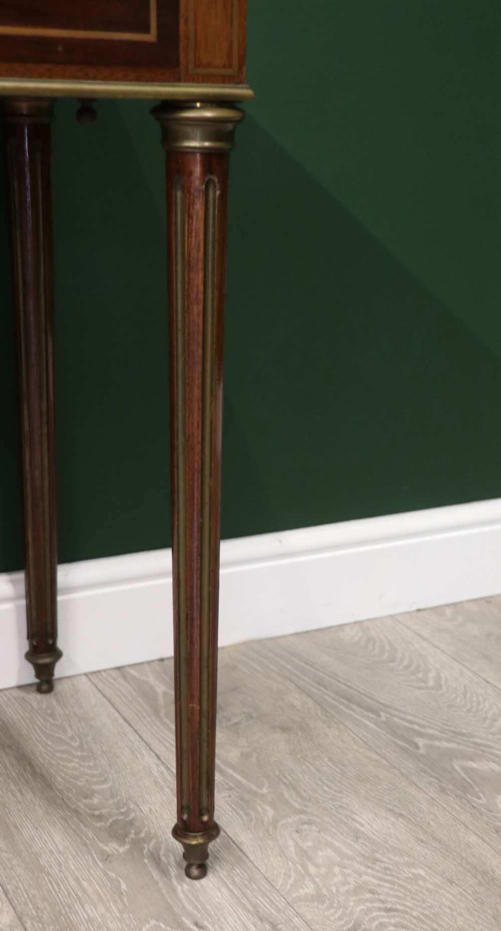 A late nineteenth-century French wooden vanity table featuring an open hinged lid with a mirror, interior satinwood compartments, and slender fluted legs. View XIV