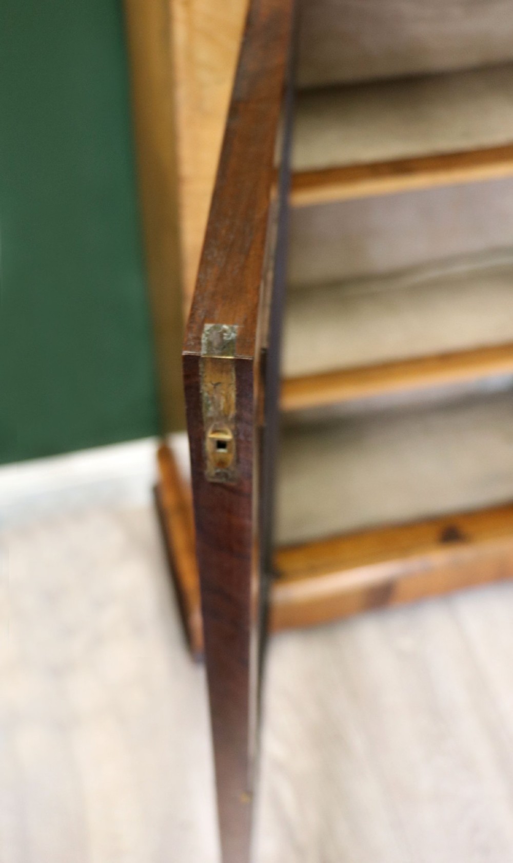 A mid-Victorian low walnut veneered bookcase featuring two glass glazed doors, marquetry inlay along the frieze, and brass trim detailing. View XII