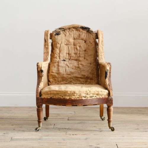 19TH CENTURY HOWARD SONS WINGBACK ARMCHAIR