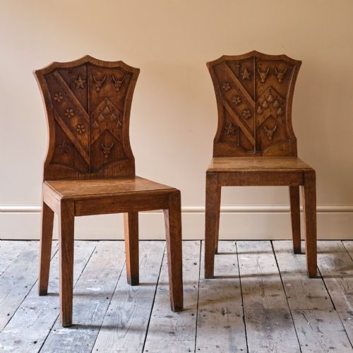 PAIR OF 19TH CENTURY ARMORIAL HALL CHAIRS - ADDITIONAL PHOTO 1
