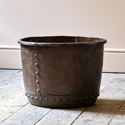 A 19TH CENTURY RIVETTED COPPER LOG BIN