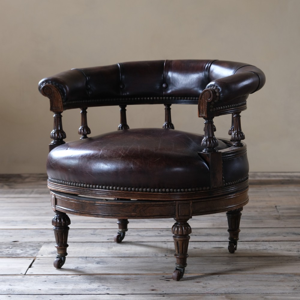 19th century rosewood and leather swivel chair by Druce & Co View II