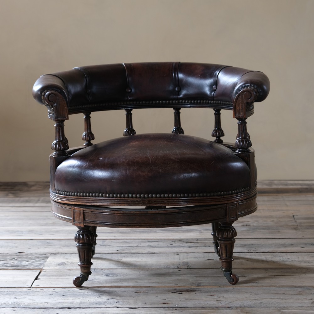 19th century rosewood and leather swivel chair by Druce & Co View III