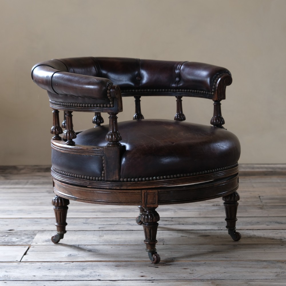 19th century rosewood and leather swivel chair by Druce & Co View IV