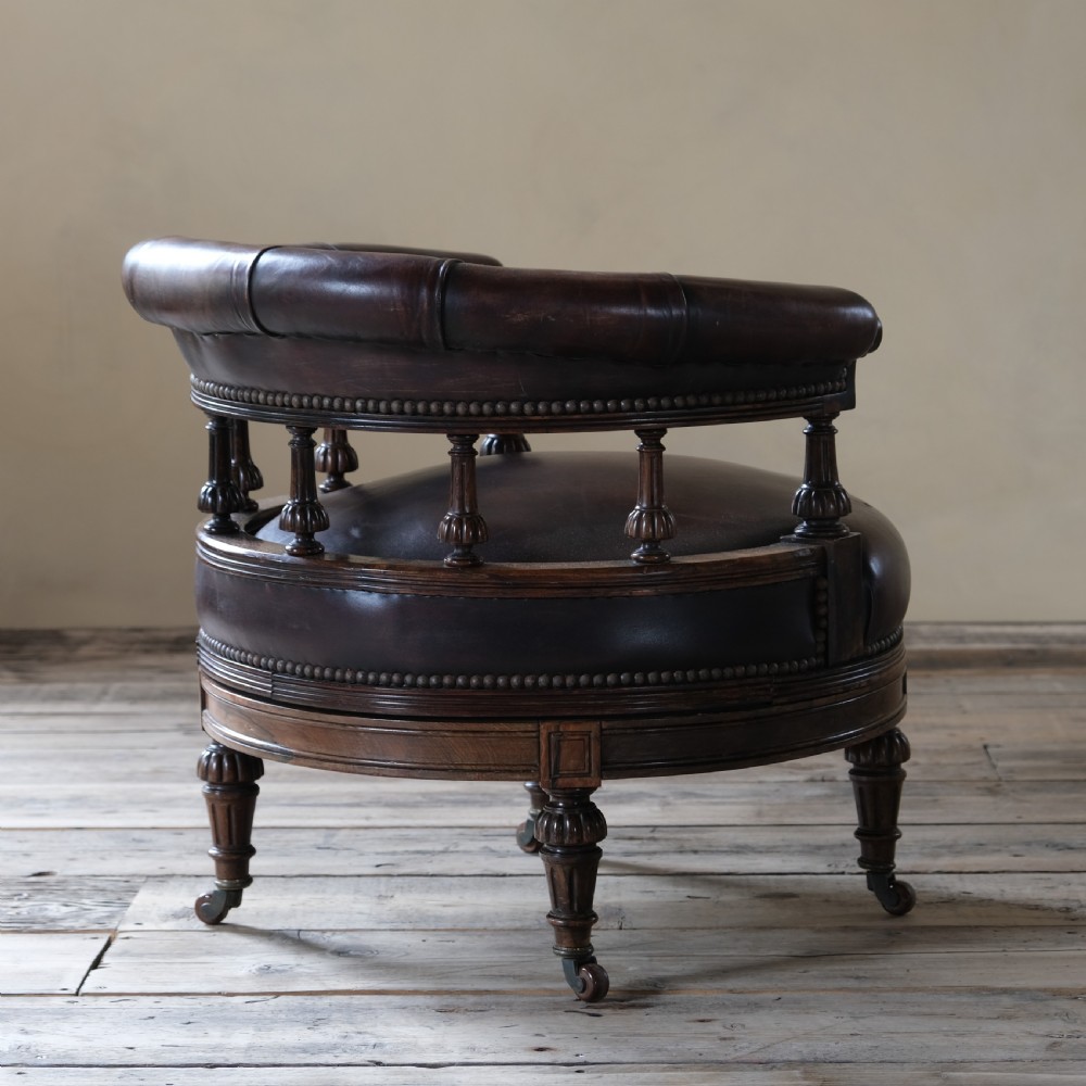 19th century rosewood and leather swivel chair by Druce & Co View V