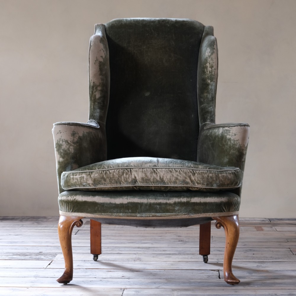 Late 19th century threadbare green velvet wingback armchair