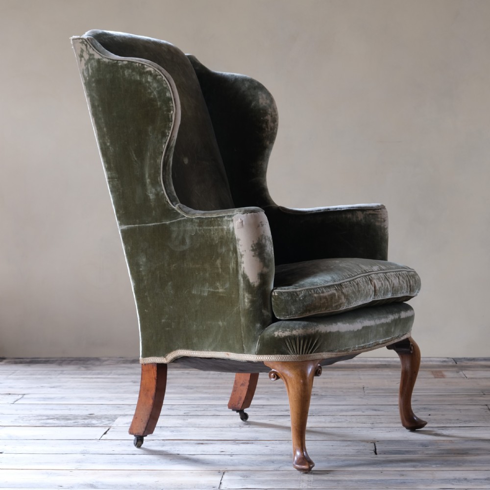 Late 19th century threadbare green velvet wingback armchair View II