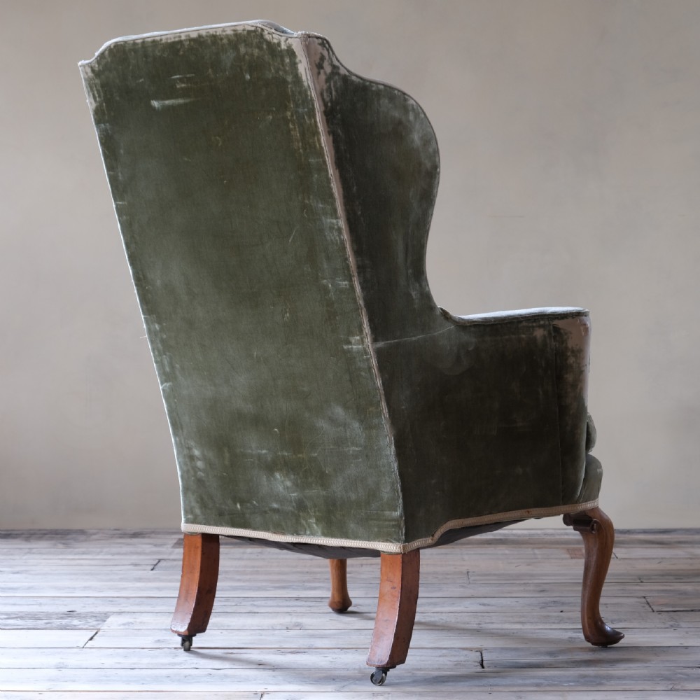 Late 19th century threadbare green velvet wingback armchair View V