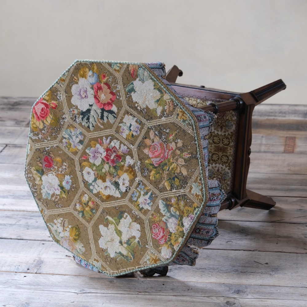 A 19th-century octagonal Aesthetic Movement side table with turned ebonised legs, a lower shelf, and a beaded tapestry top. View III