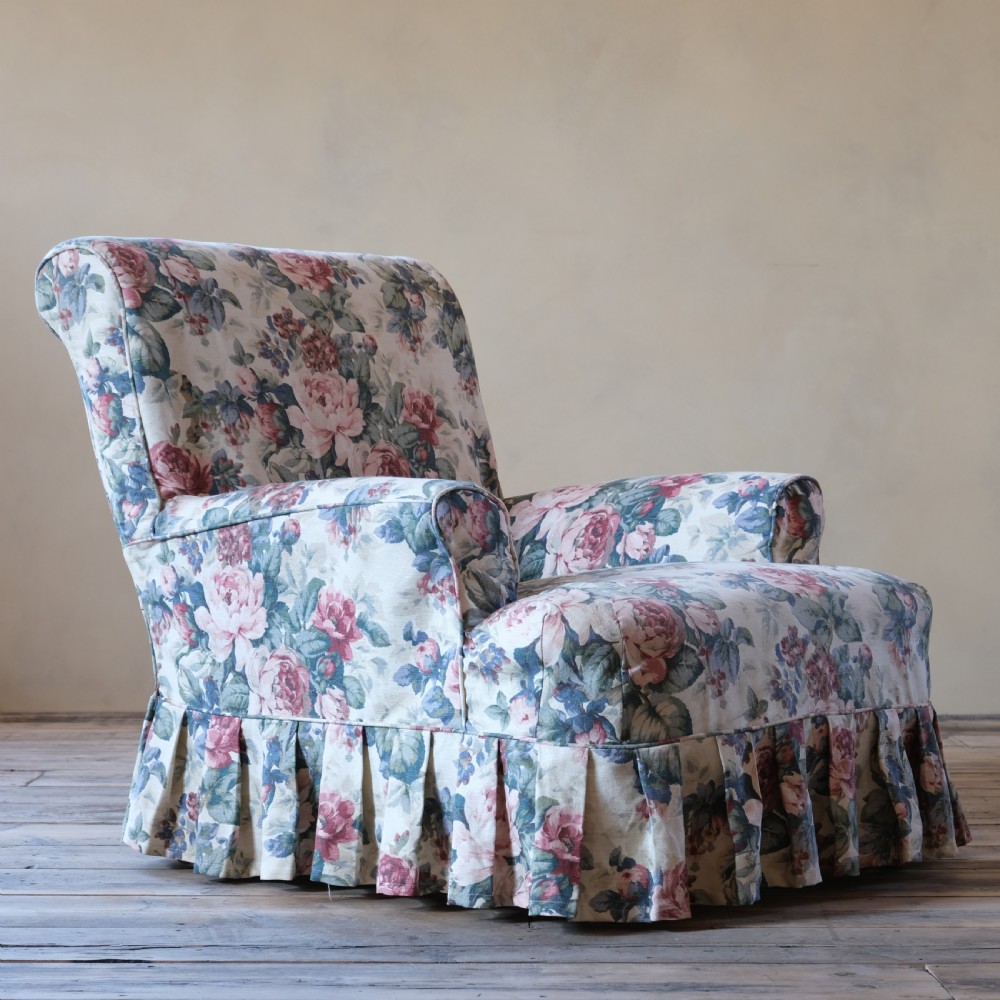 19th century country house armchair in floral loose cover View II