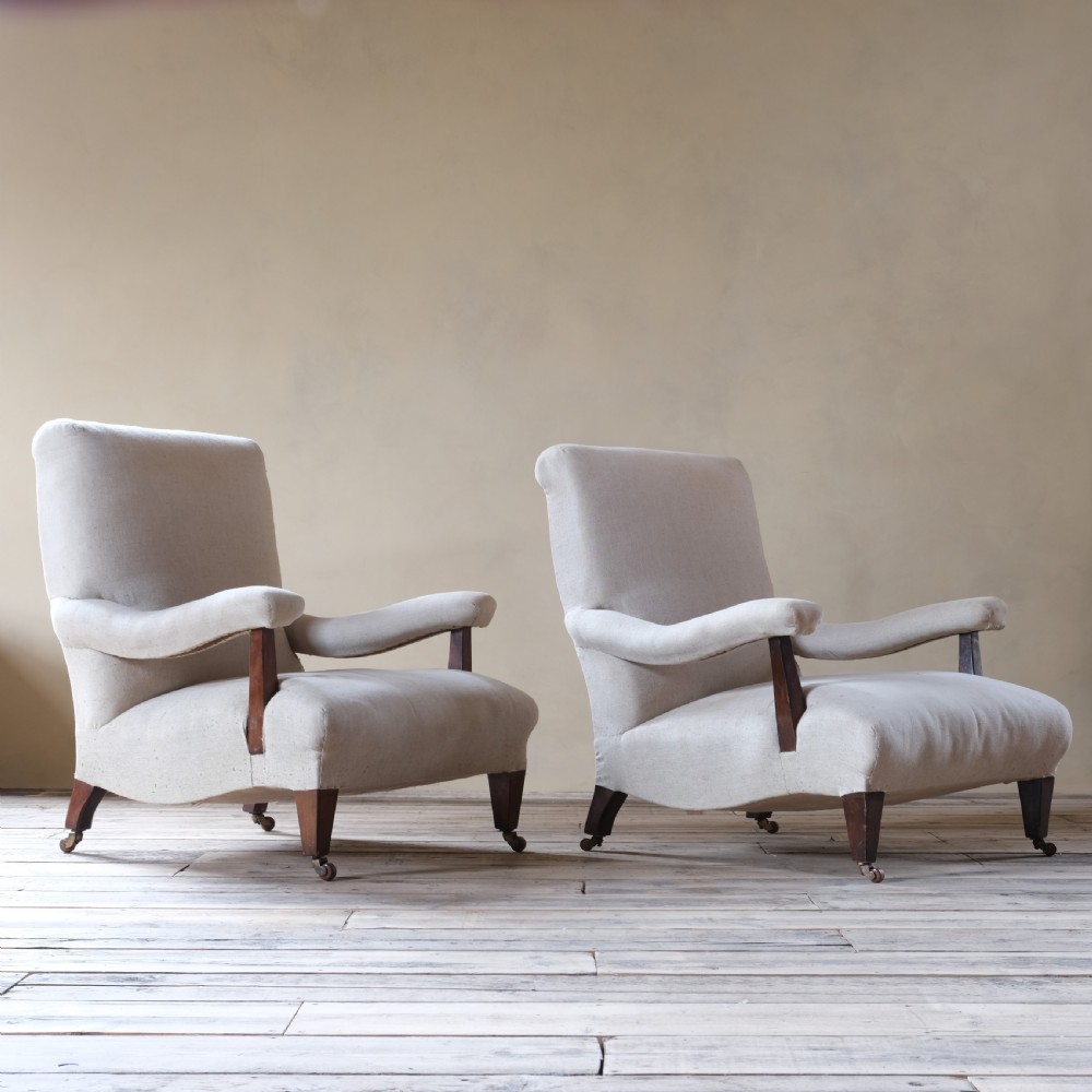 A pair of large Howard style open armchairs View III