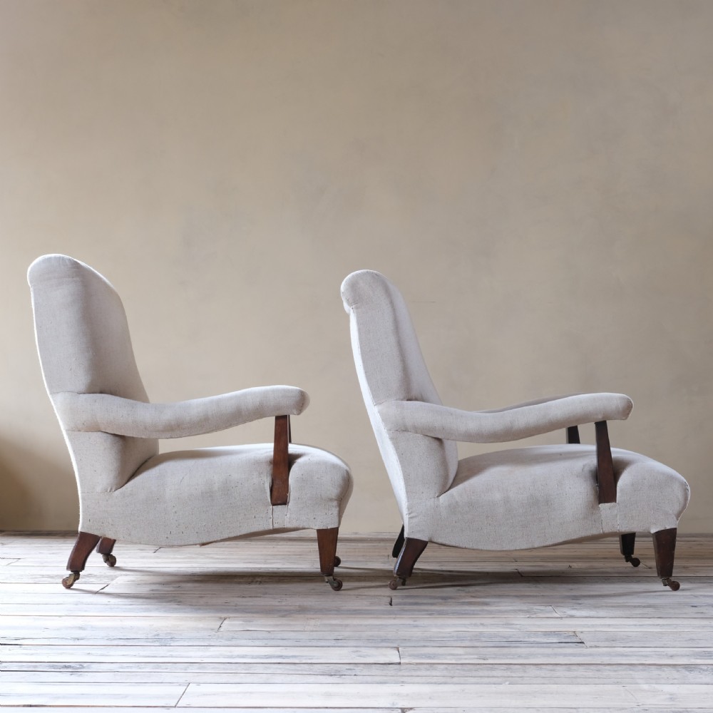 A pair of large Howard style open armchairs View IV