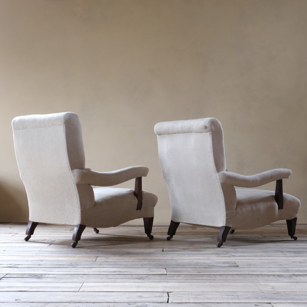 A pair of large Howard style open armchairs View V