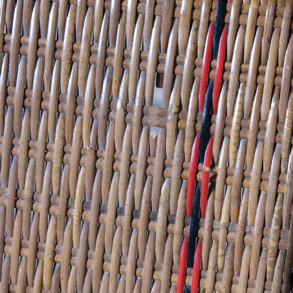 An antique French bamboo reclining chaise longue with a woven cane seat, raised armrests, and extending footrest. View XII