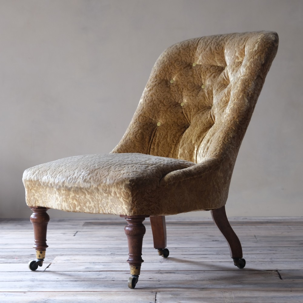 A large mid 19th century walnut slipper chair c1860