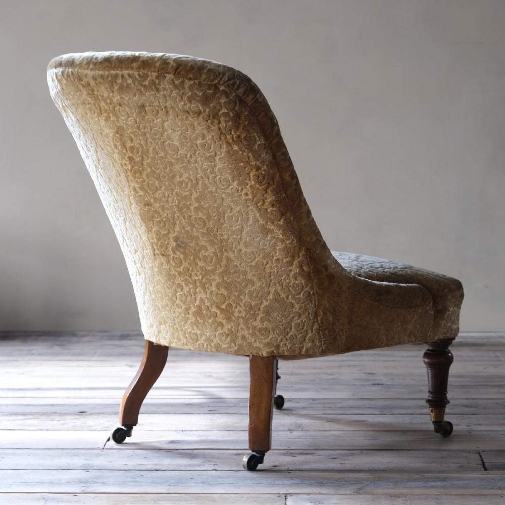 A large mid 19th century walnut slipper chair c1860 View IV