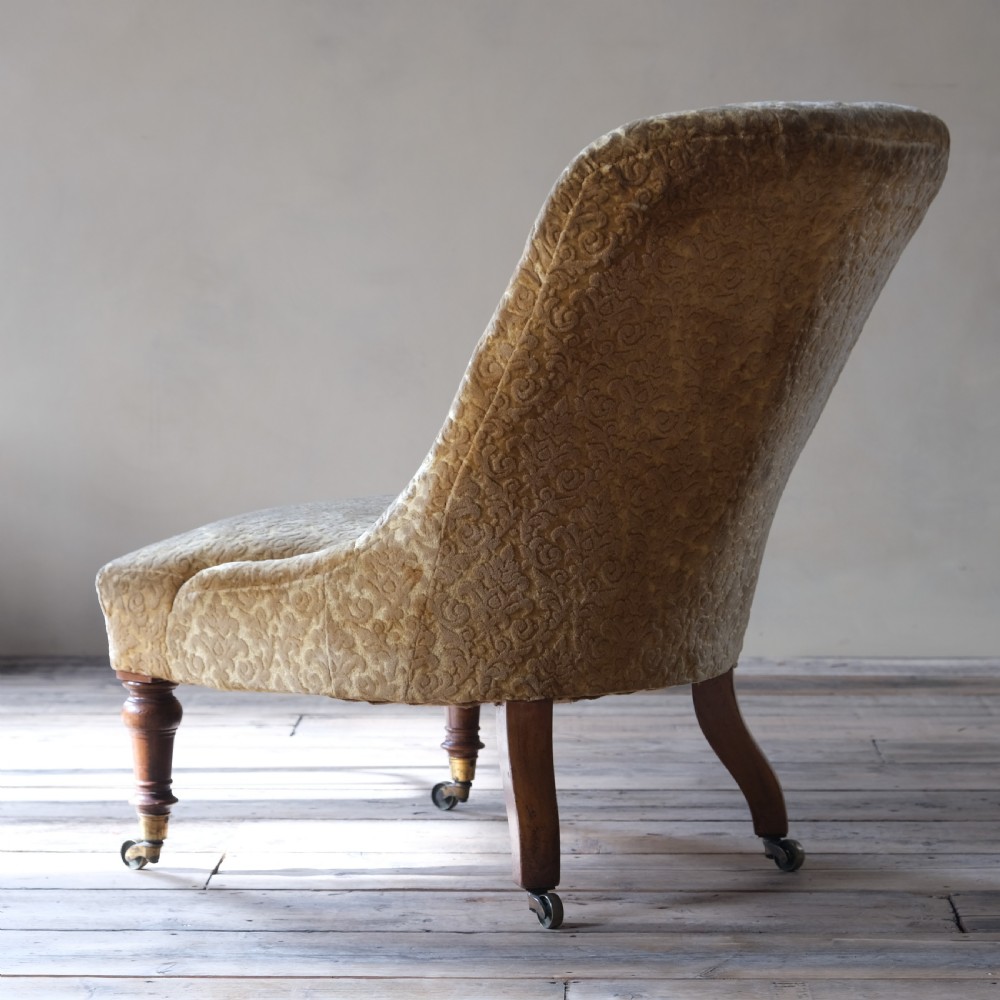 A large mid 19th century walnut slipper chair c1860 View V