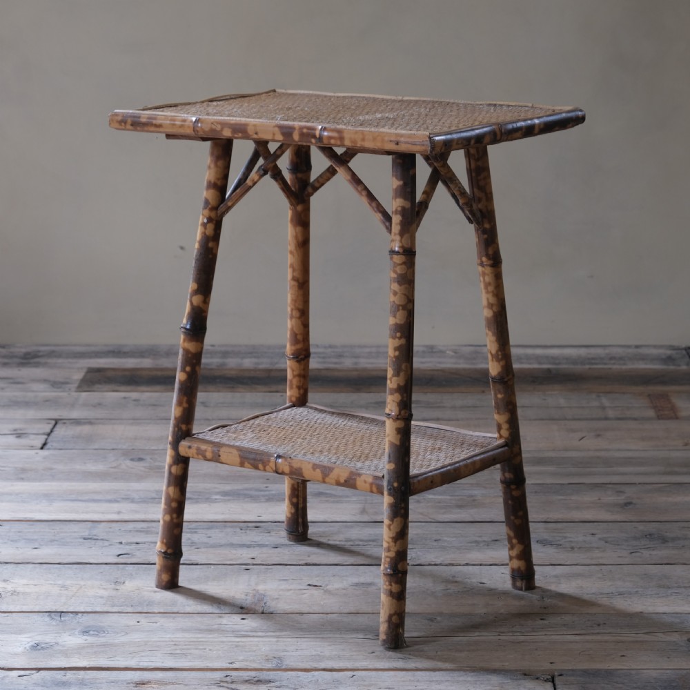 A 2 tier bamboo and rattan side table