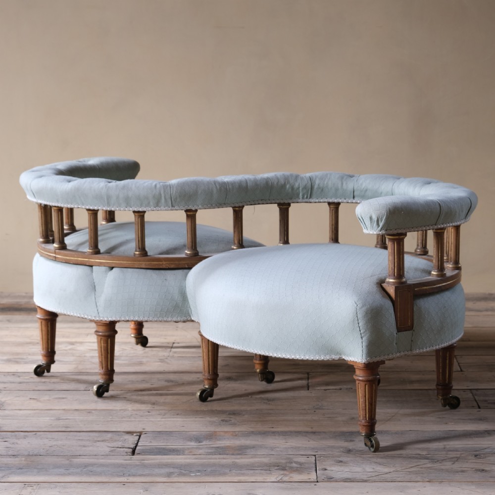 A petite 19th century walnut conversation sofa almost certainly by Gillows View II