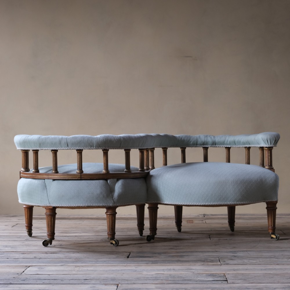 A petite 19th century walnut conversation sofa almost certainly by Gillows View III