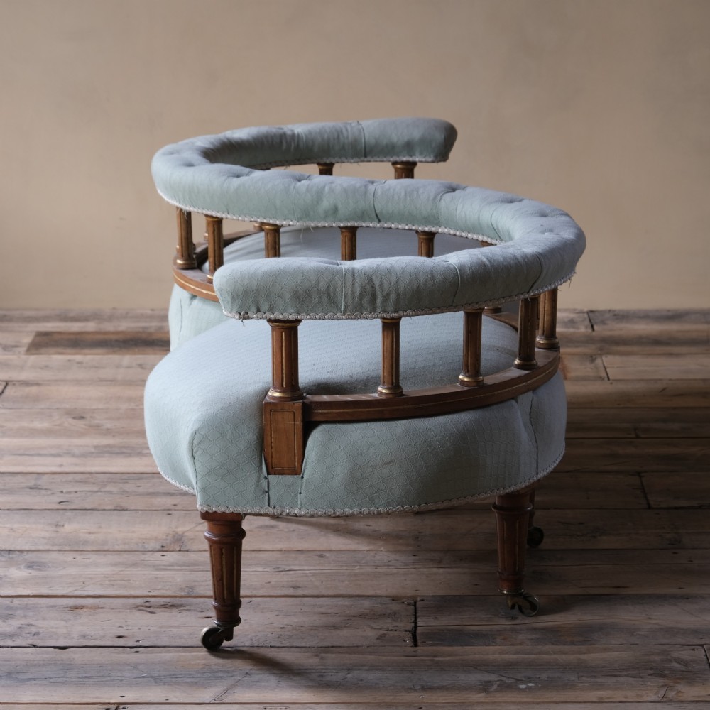 A petite 19th century walnut conversation sofa almost certainly by Gillows View V