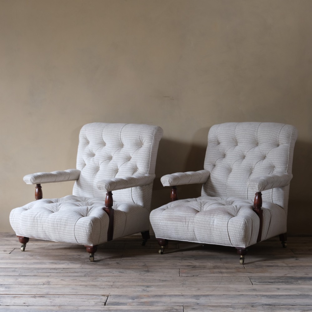 A pair of 19th century fully buttoned open armchairs View V