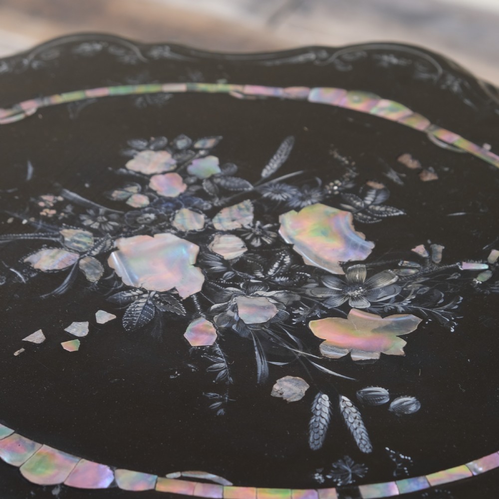 A 19th-century black lacquer papier-mache side table featuring a scalloped floral inlaid top on a turned pedestal with scroll feet. View III