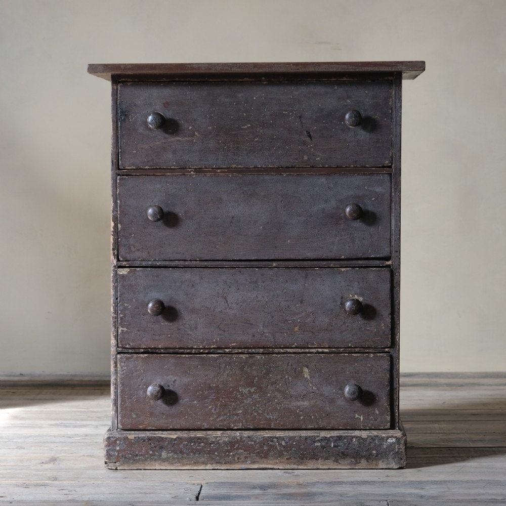 A small 19th century grained pine chest of drawers