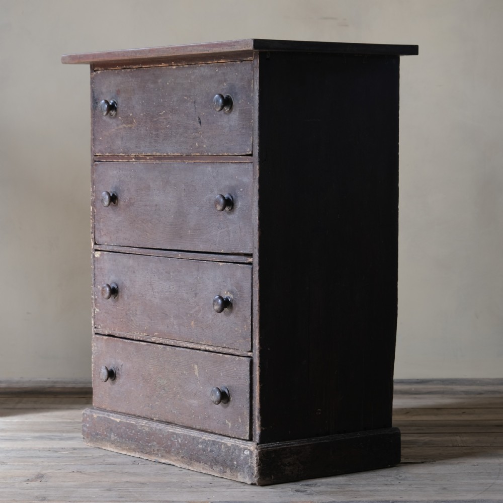 A small 19th century grained pine chest of drawers View III
