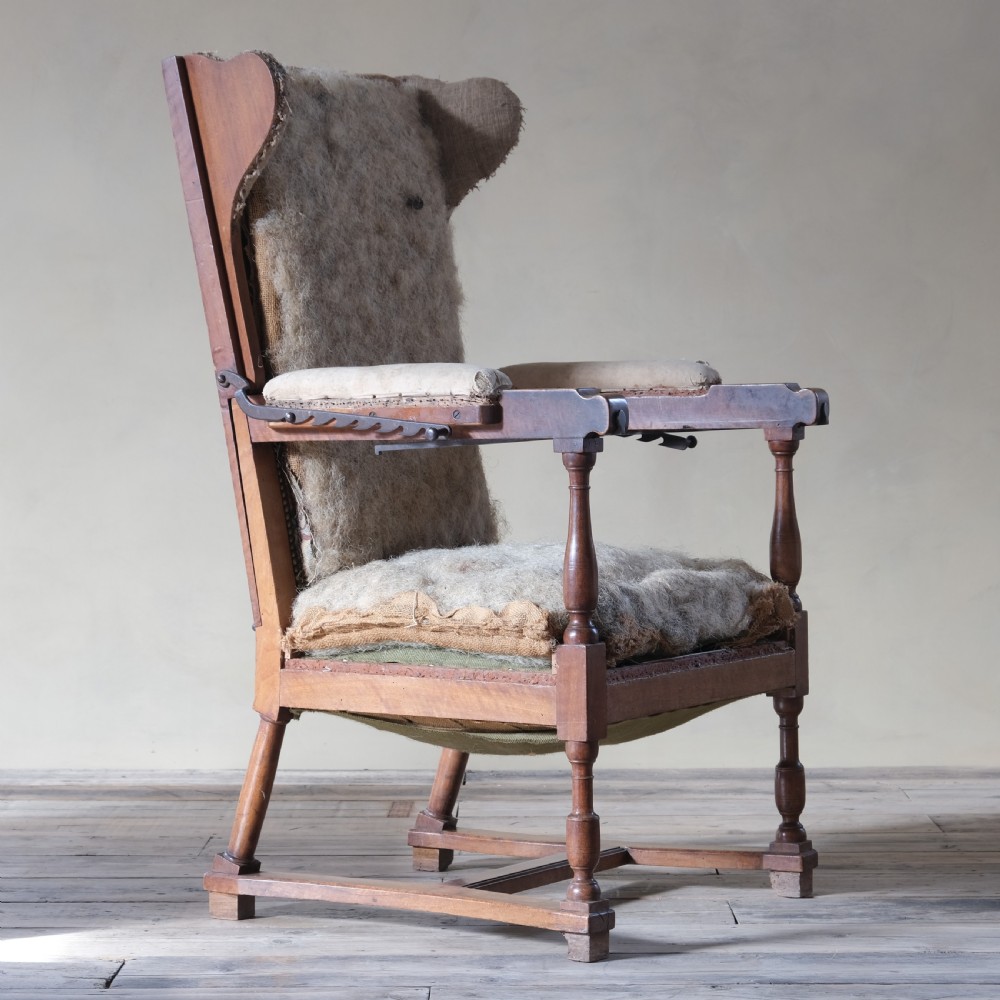 19th century French walnut reclining wingback armchair