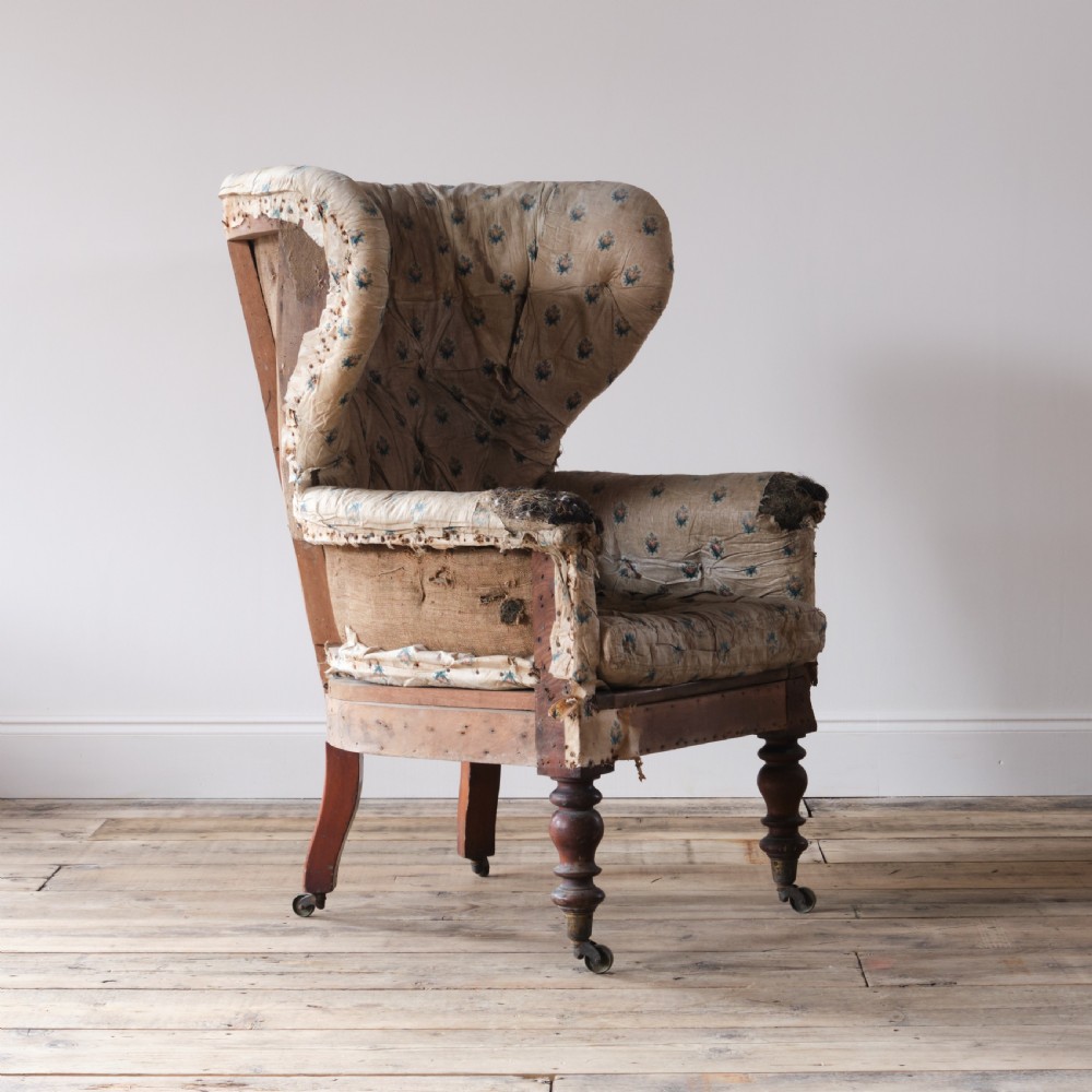 An early 19th century barrel back armchair View V