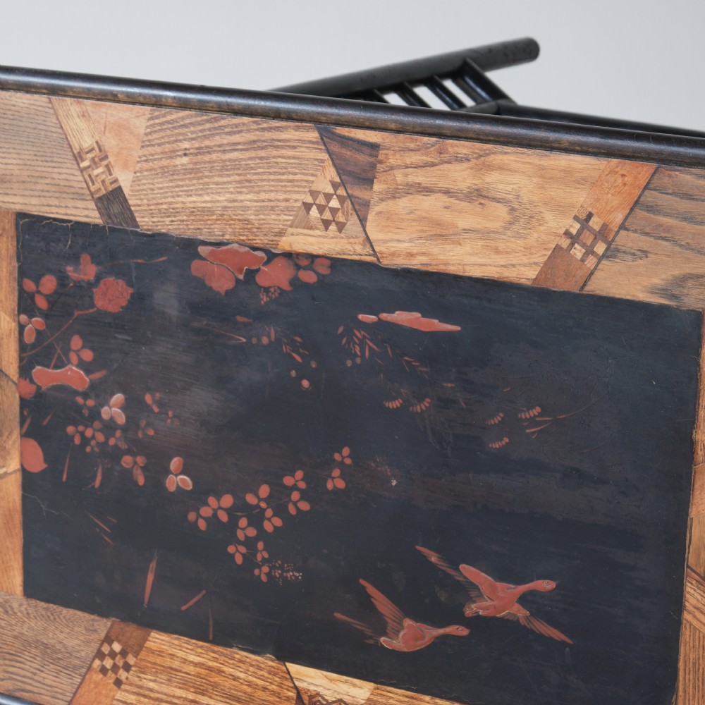 A Victorian Anglo-Japanese ebonised black lacquered three-tier side table featuring lattice side panels and spindled shelf galleries. View IX