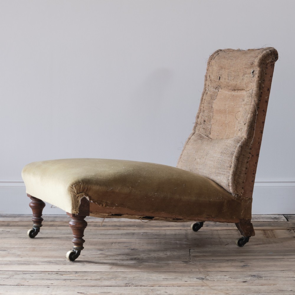 Low deep seated 19th century Howard style slipper chair