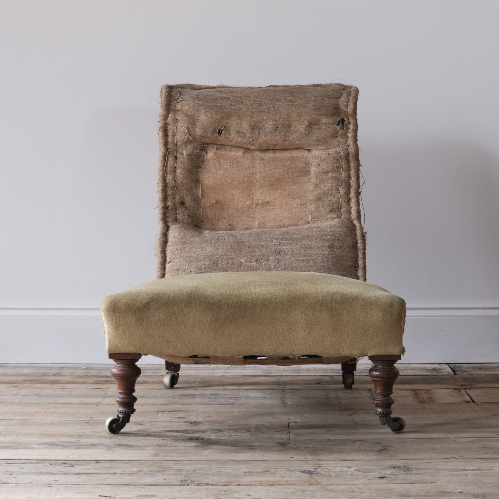 Low deep seated 19th century Howard style slipper chair View II