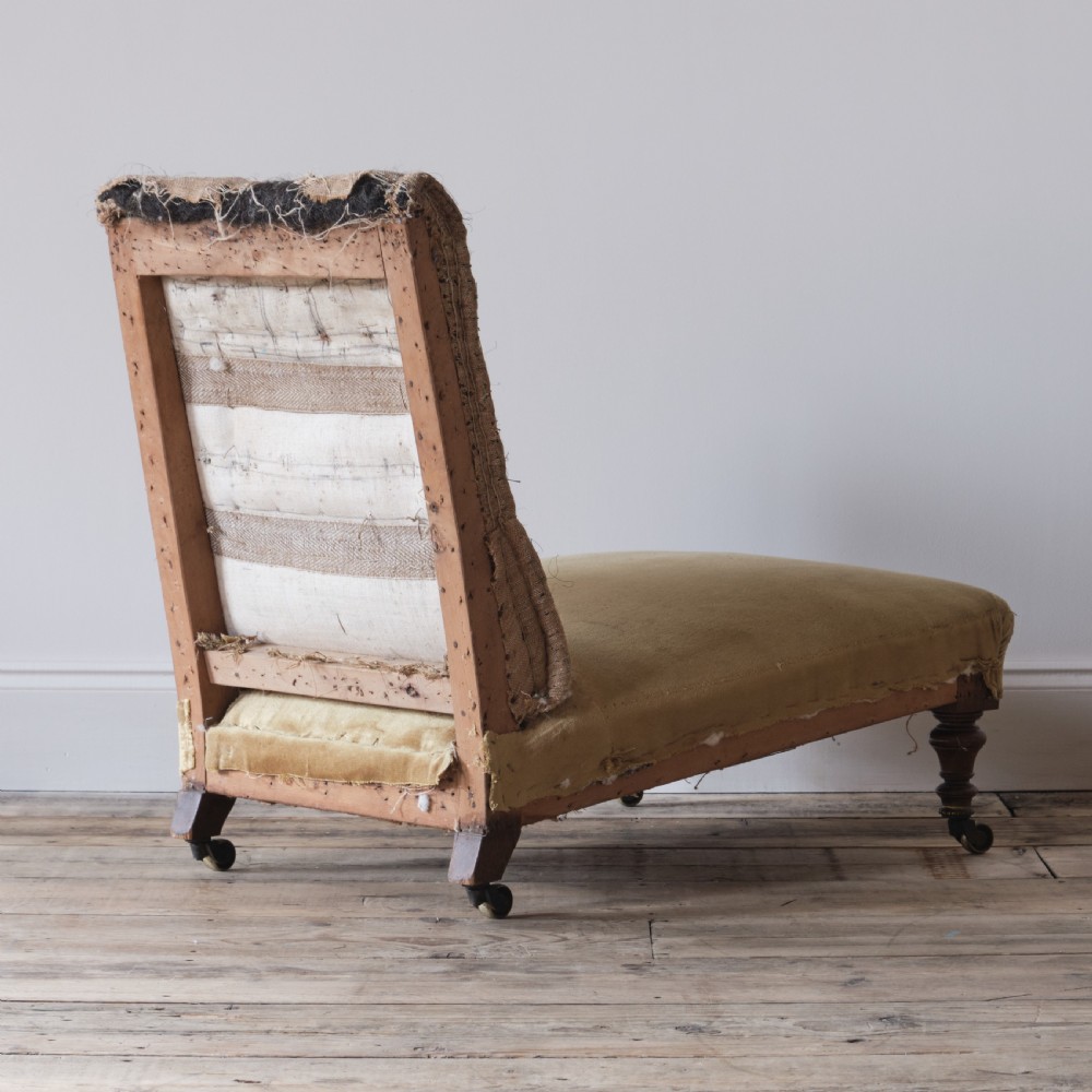 Low deep seated 19th century Howard style slipper chair View V