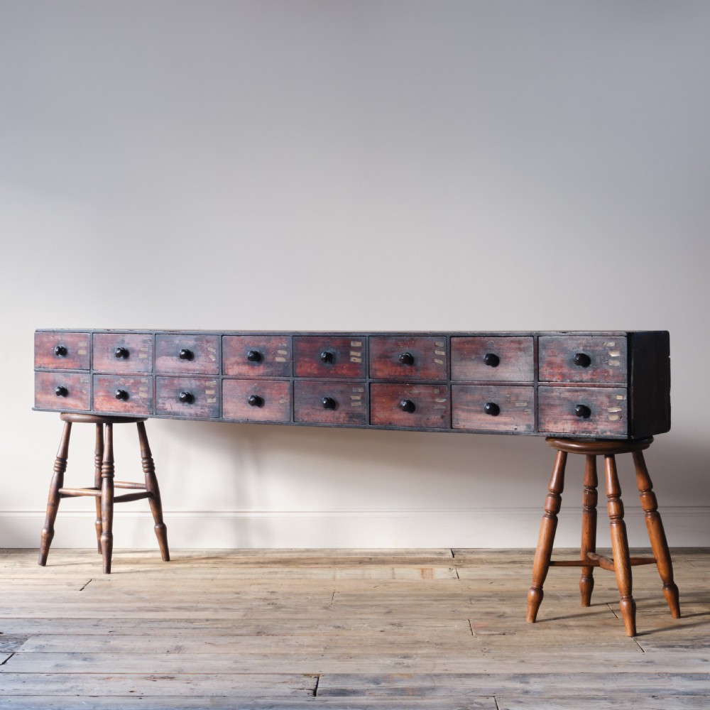 19th century mahogany bank of 16 worktop apothecary drawers View II
