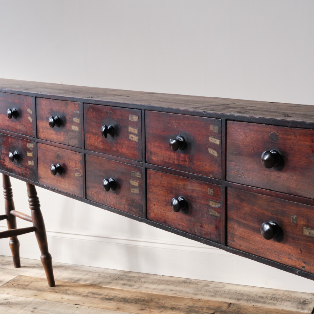 19th century mahogany bank of 16 worktop apothecary drawers View III